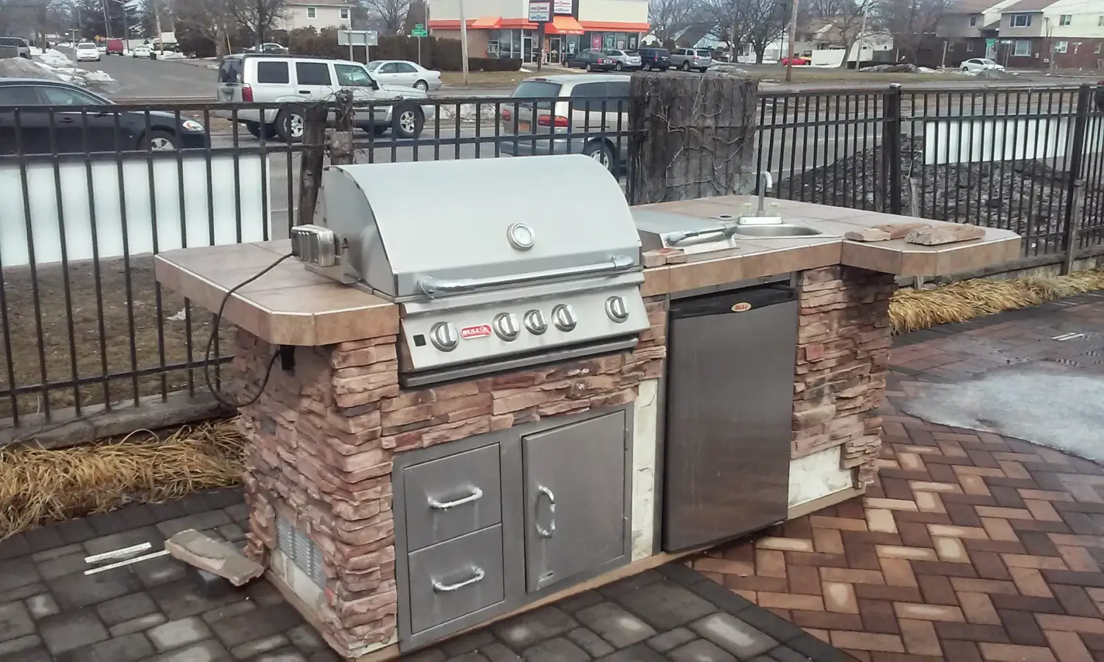 Stacked-stone outdoor kitchen by Promaster Maintenance Corp, Long Island, NY