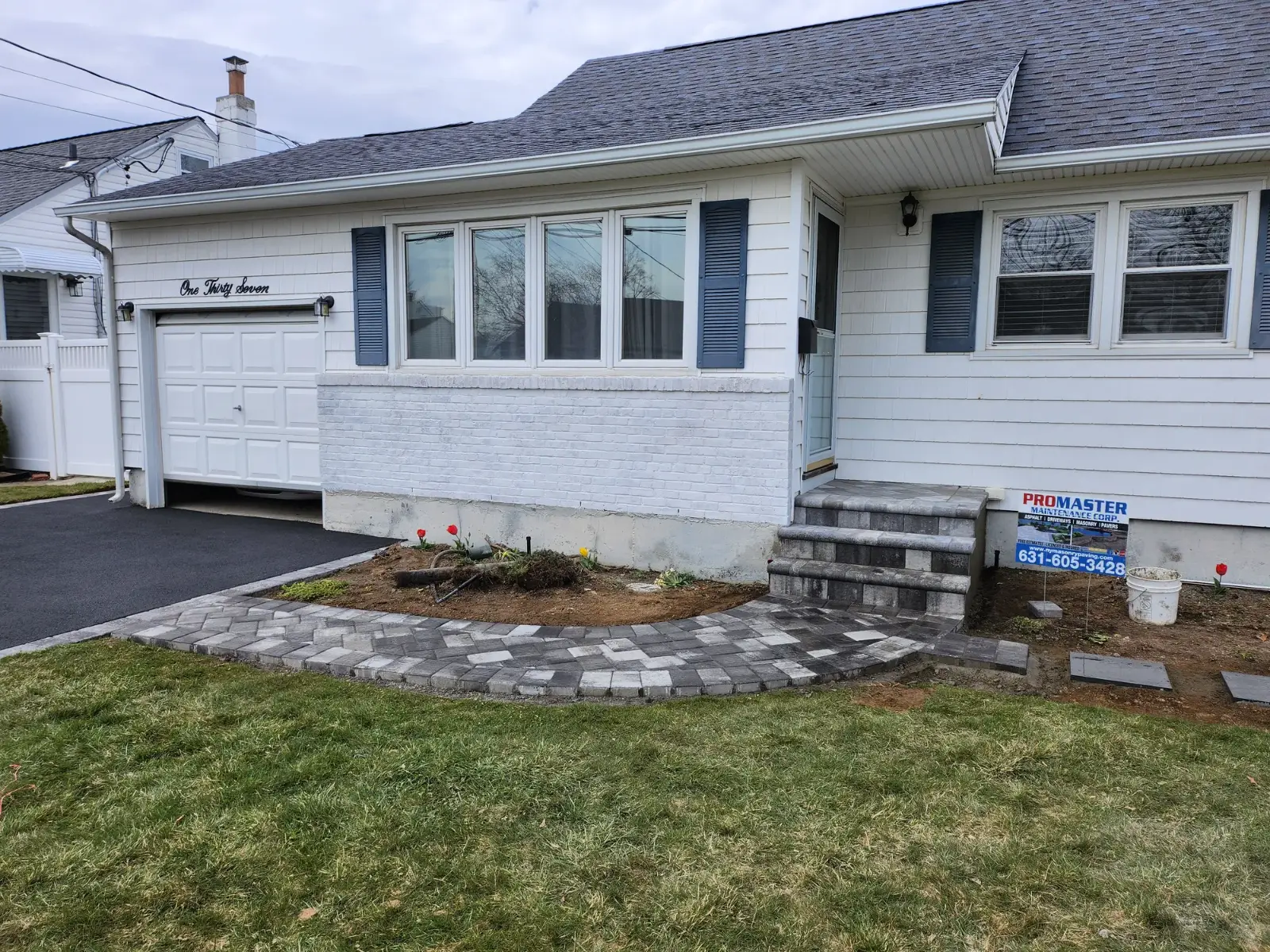 Curved walkway to new paver steps by Promaster Maintenance Corp, Long Island, NY