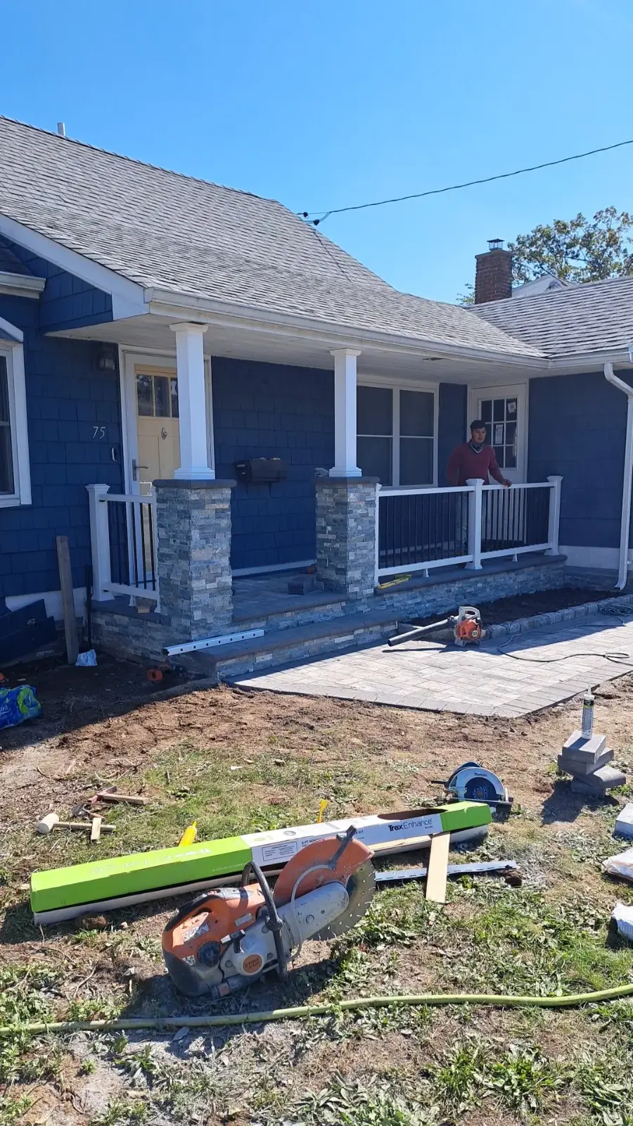 Front porch with stacked-stone columns by Promaster Maintenance Corp, Long Island, NY