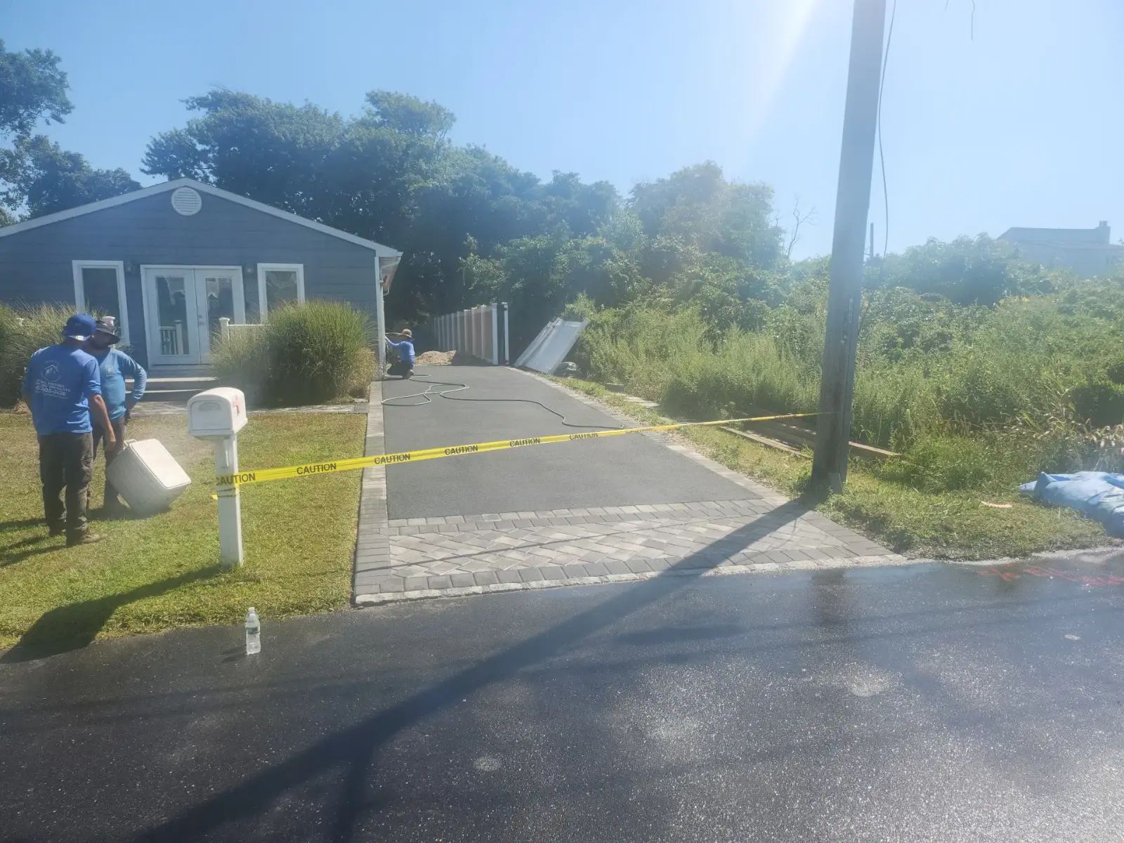 Paver-bordered driveway and entry landing by Promaster Maintenance Corp, Long Island, NY
