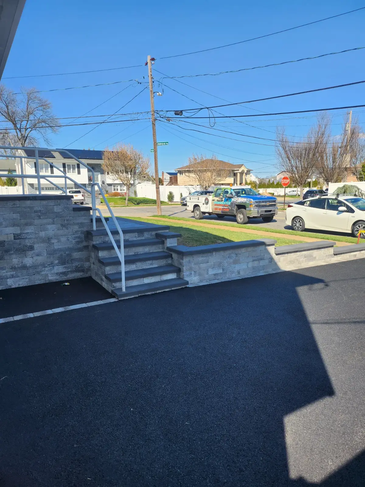 Paver steps and wall at the driveway by Promaster Maintenance Corp, Long Island, NY