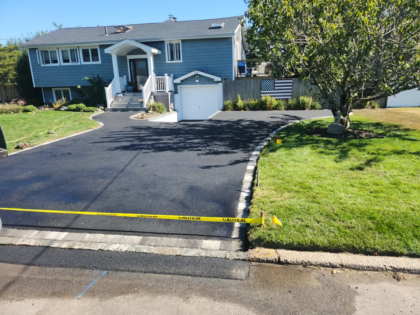 Asphalt driveway with Belgian block curb by Promaster Maintenance Corp, Long Island, NY