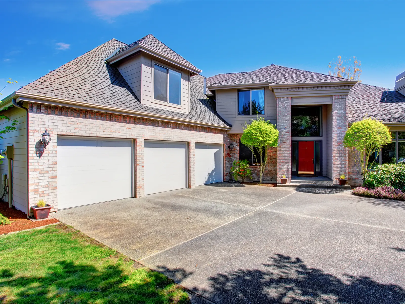 Brick-front home with a concrete driveway