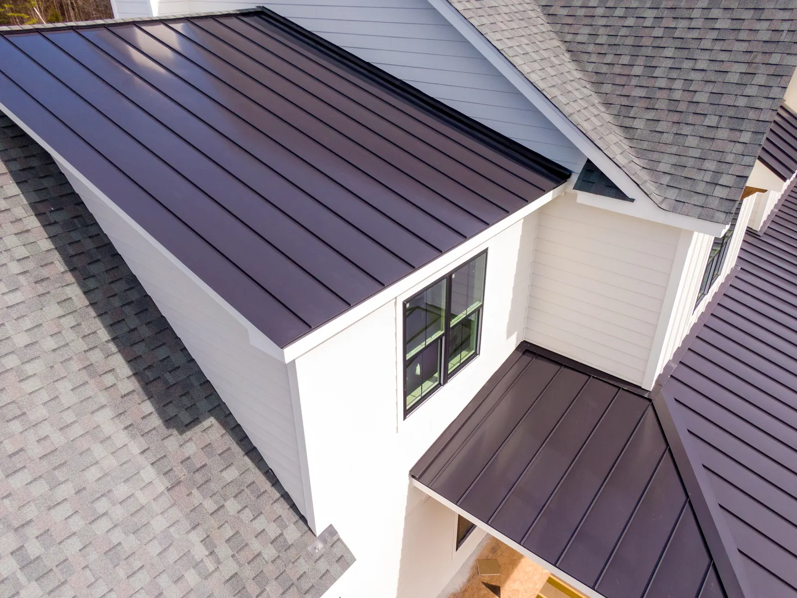 Standing-seam metal roof on a sided home